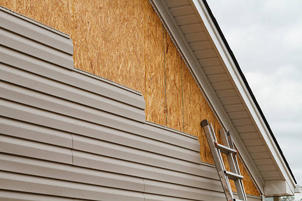 Professional Emergency Siding Repair technician working in Belle Center, OH
